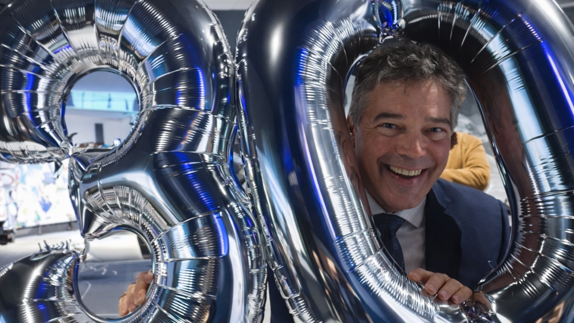 CEO, Duncan McCready, celebrating IC Group's 30 year anniversary with baloons.